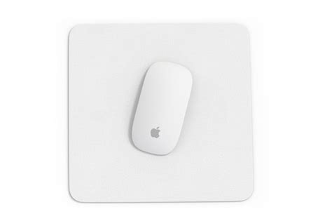 Premium Photo | A white mouse pad with the apple logo on it.