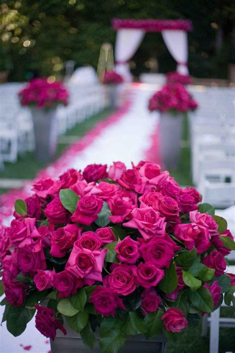 Ceremony Décor Photos - Hot Pink Roses - Inside Weddings