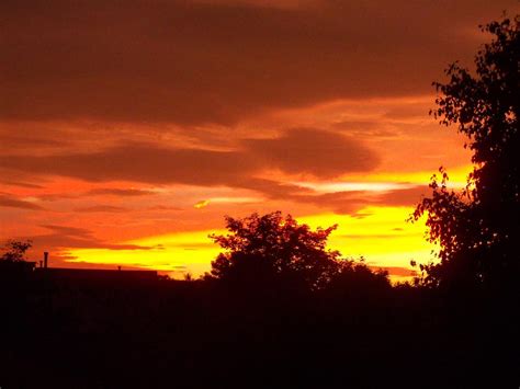 Orange Red And Yellow Sunset Photograph by Corinne Elizabeth Cowherd