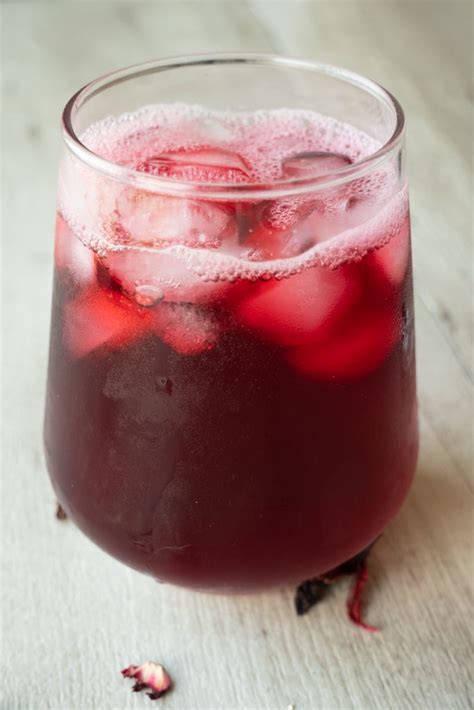 a close up of a drink in a glass on a table