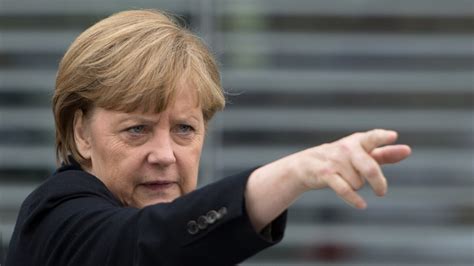 Merkel Tells Putin To Give NGOs A 'Good Chance'