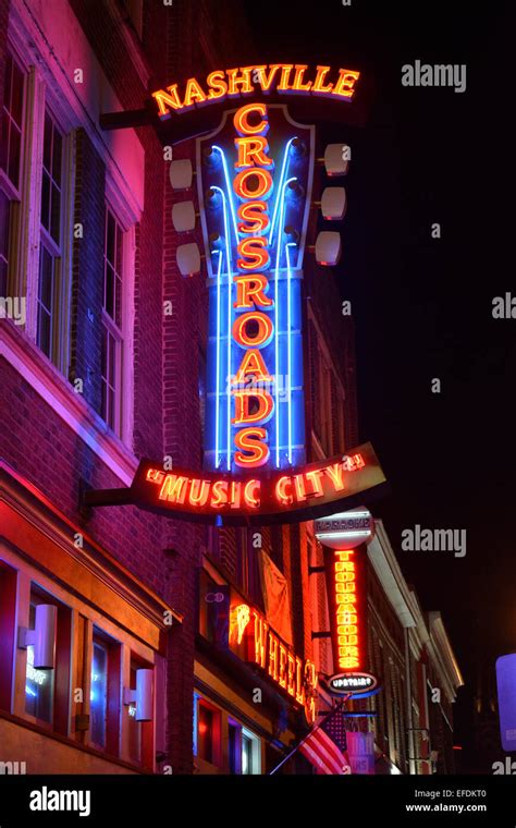 A night shot of the neon sign for Nashville Crossroads, a music venue ...