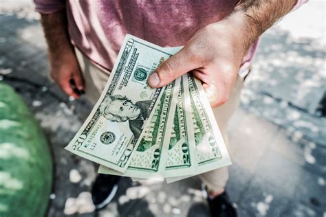 Picture of Money In Hand - Free Stock Photo