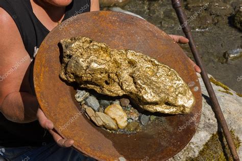 Gold Nugget mining from the River — Stock Photo © Luftklick #113218382