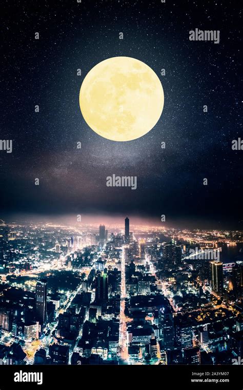 aerial view of city at night with full moon Stock Photo - Alamy