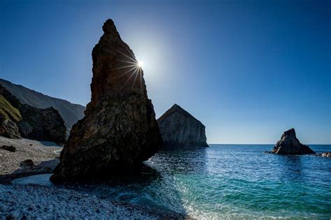 Photo Prints Wall Art - Coastal sea stacks and pinnacles from a storm beach beneath Slieve Tooey ...