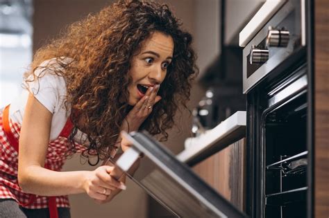 Free Photo | Woman baking meal in the oven