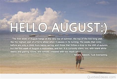 a man standing on top of a sandy beach next to the ocean in front of a ...