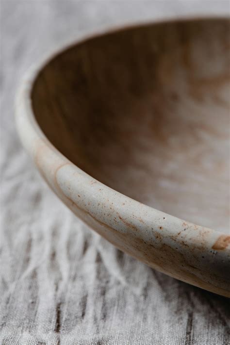 Brown Wooden Round Bowl on White Textile · Free Stock Photo