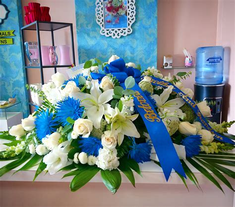 Blue And White Casket Spray in Downey, CA | Chita's Floral Designs