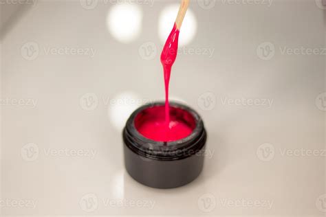 Pink gel nail polish in a jar. Bright gel polish 14420390 Stock Photo at Vecteezy