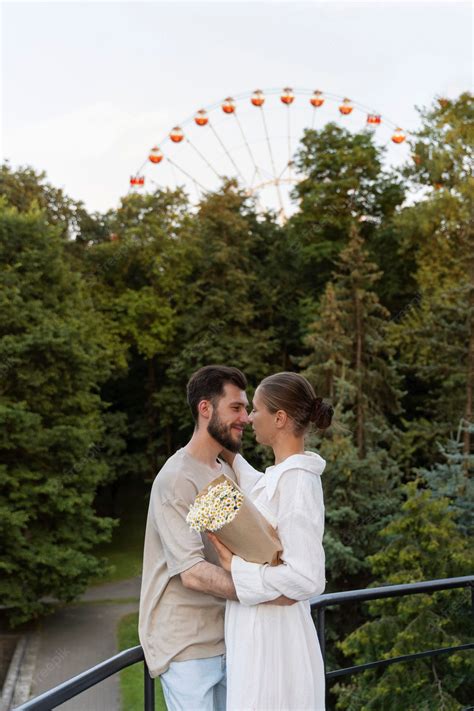 Premium Photo | Romantic couple out together at the ferris wheel in the ...