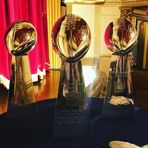 Super Bowl trophies on display in the theater of Casa Bonita yesterday morning. The lighting ...