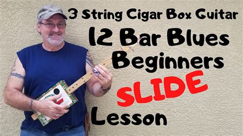 How to play a 3 string Cigar Box Guitar - Beginner slide lesson 12 Bar ...