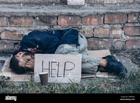 Poor homeless man begging for help outdoors Stock Photo - Alamy