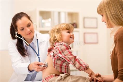 Pediatrician Examine Child Girl With Stethoscope Stock Image - Image of ...