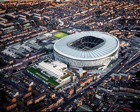 an aerial view of a city: Seven months behind schedule, Tottenham's 62,062-capacity stadium is ...