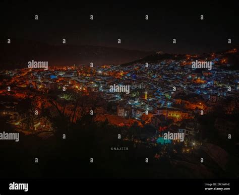 An aerial view of the Chefchaouen city illuminated with colorful lights at night Stock Photo - Alamy