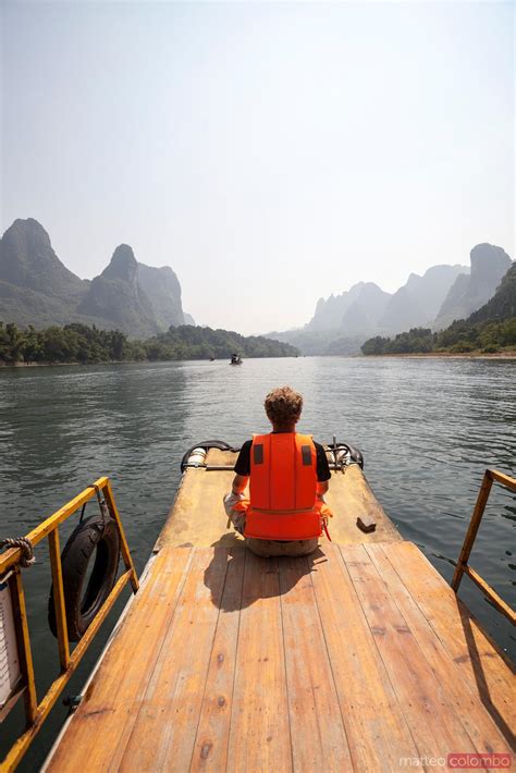 - Bamboo raft on Li river with famous karst peaks | Royalty Free Image