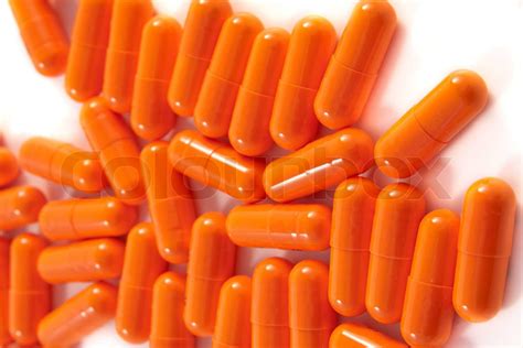 orange pills assortment on white bakcground | Stock image | Colourbox