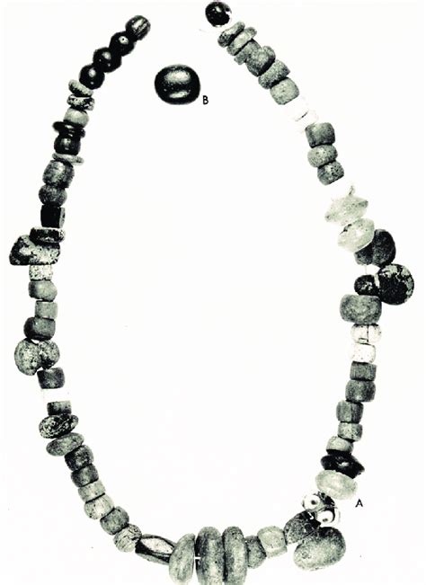 Grave goods from grave 15. A: bead necklace and B: flint. Photo: LUHM.... | Download Scientific ...