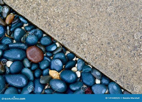 Contrast Textures of a Paved Driveway and Pebbled Sidewalk. Background Image. Stock Image ...