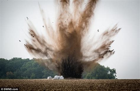 Having a blast! Bomb squad forced to blow up wartime explosive in field after finding garage ...