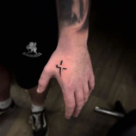 Cross Sign Tattoo Ideas For Men | Cross tattoo on hand. - TiptopGents