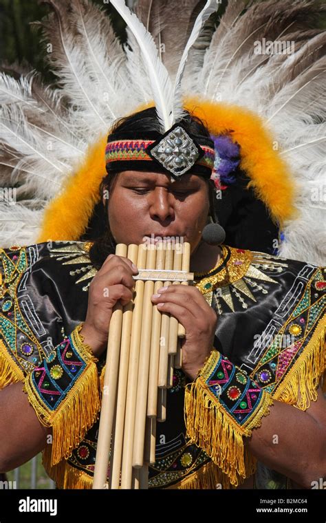 South American indian playing a panflute at a market in Sweden Stock ...