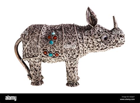 a silver rhino figurine isolated over a white background Stock Photo ...