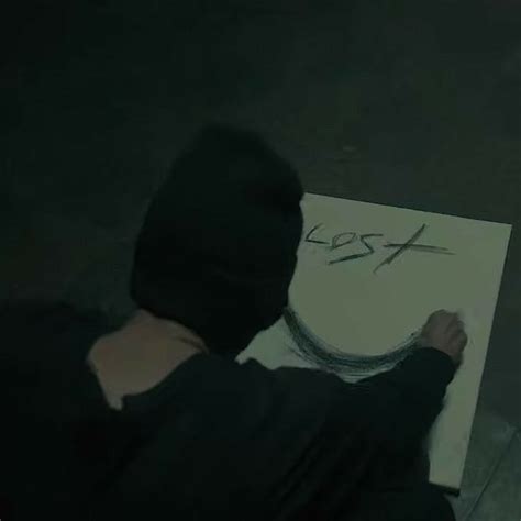 a person is drawing on a piece of paper with the word xsx in it