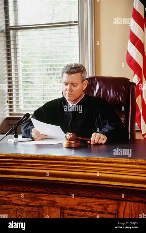 Judge in robe with gavel in courtroom, USA Stock Photo - Alamy