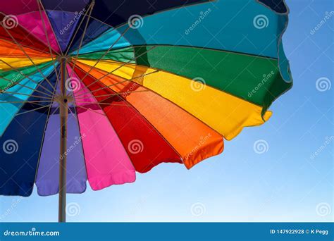 Colorful Beach Umbrella stock photo. Image of travel - 147922928