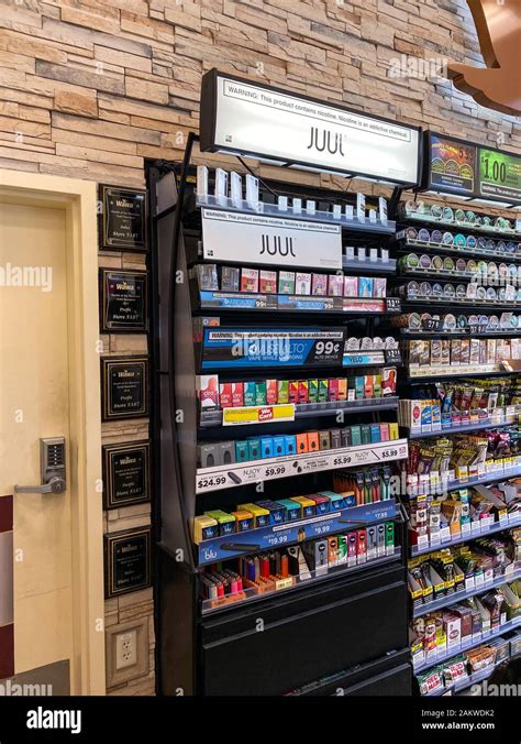 Orlando,FL/USA-12/27/19: Juul brand ecigarettes in a case at a Wawa gas station convenience ...