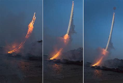 Artist Cai Guo­-Qiang Sends a 500-Meter Ladder of Fire into the Sky ...