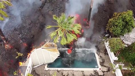 Drone footage of Spanish volcano shows lava swallowing swimming pool | CBC.ca