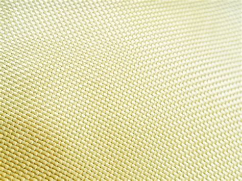 Premium Photo | Bulletproof material aramid aramid kevlar background golden kevlar texture and ...