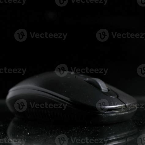 Black computer mouse on black background 17340747 Stock Photo at Vecteezy