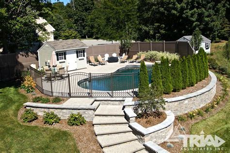 Retaining Walls | Triad Associates | Inground pool landscaping, Backyard pool landscaping, Pool ...