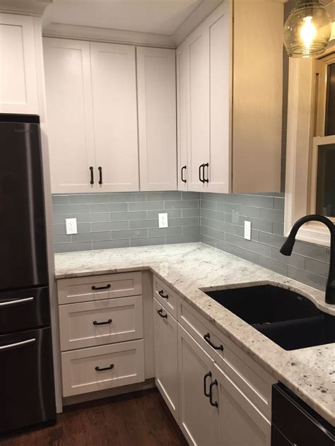 Colonial white granite with gray glass backsplash | Modern grey kitchen, Kitchen design, Grey ...