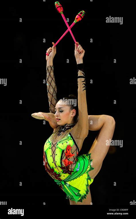 woman doing rhythmic gymnastics with clubs Stock Photo - Alamy