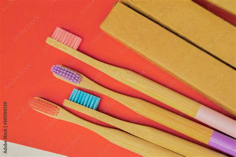 Colorful bamboo toothbrush on red background. Zero waste. Eco friendly ...