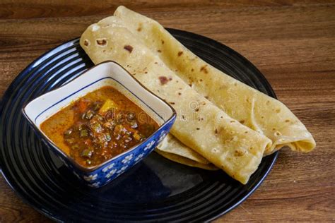 Chapati with Chicken Curry Mix with Sardine Sambal Stock Photo - Image ...