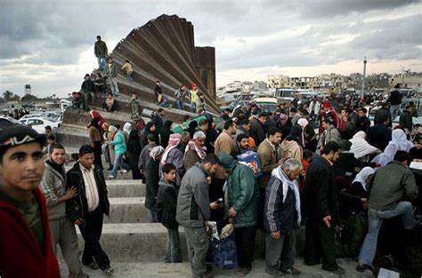 Palestinians Topple Gaza Wall and Cross to Egypt - The New York Times