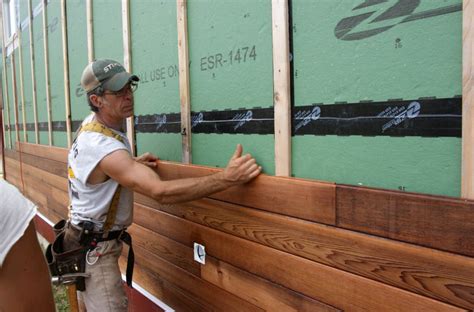 Adam installing stained tongue and groove red cedar siding | Wood siding exterior, Exterior ...