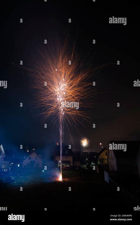 Silvester fireworks in a residential area on New Year's Eve Stock Photo - Alamy