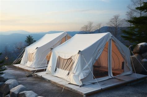 Premium Photo | Mountain resorts winter allure with white camping tents ...