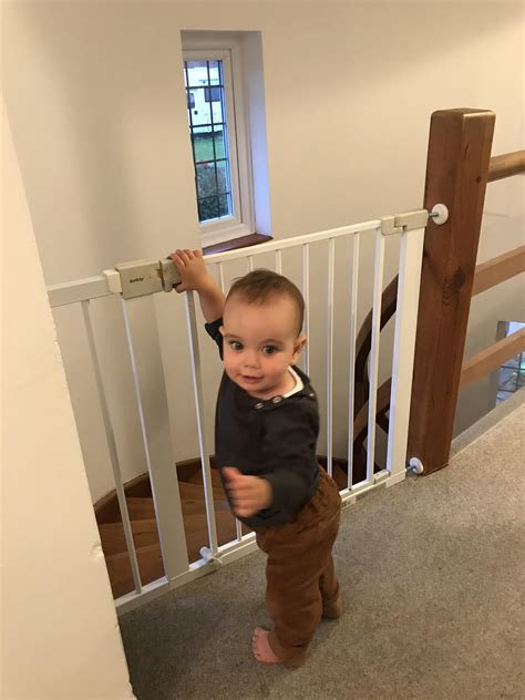 Just installed the stair gate. He knows exactly how it works already. : r/daddit