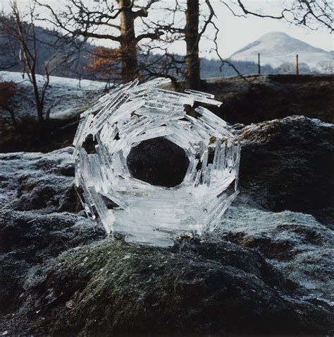 Andy Goldsworthy (b. 1956) , River Ice Wrapped Around a River Stone | Christie's