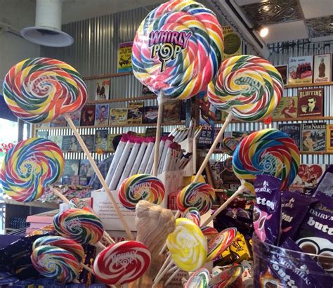 there are many lollipops on display in the store